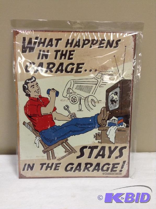 lot 152 image: What Happens In The Garage Metal Sign