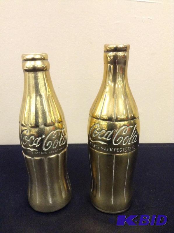 lot 60 image: Two Brass Coca Cola Bottles