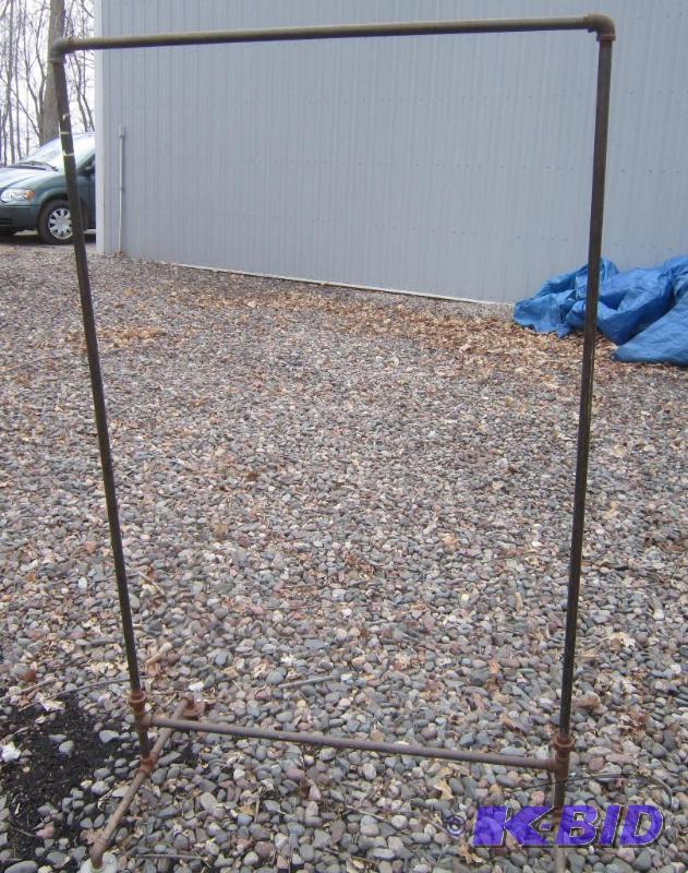 lot 298 image: Display Rack with Castors Great for Hanging Clothes or Linens