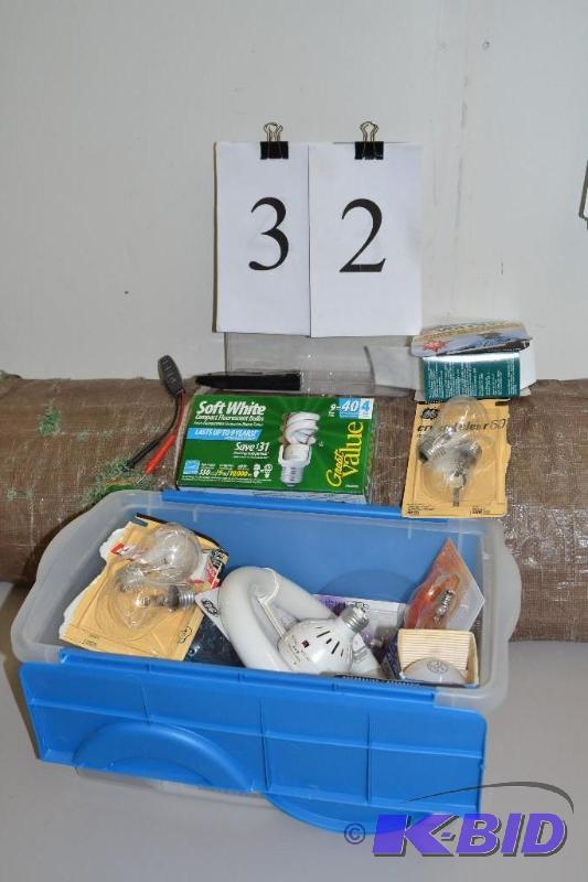 lot 32 image: Tote filled with new light bulbs, testers and tarp