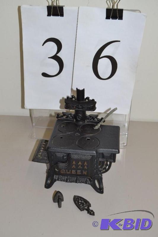 lot 36 image: Miniature cast iron stove.