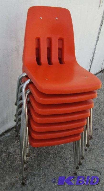 lot 44 image: Lot of 7 orange stacking chairs, slotted back...
