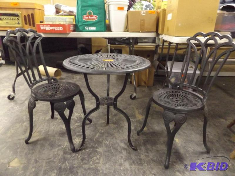 cast iron table and two chairs, lawn set...