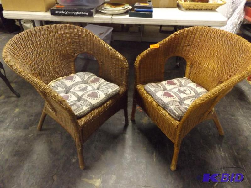 pair of outdoor wicker chairs...