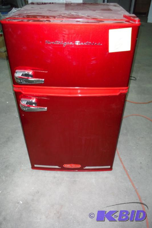 lot 6 image: Nostalgia Electrics RRF325HNRED Retro Series 3.0-Cubic Foot Compact Refrigerator Freezer, Red