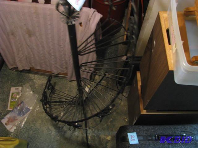 metal stand with narrow spiral steps for plan...