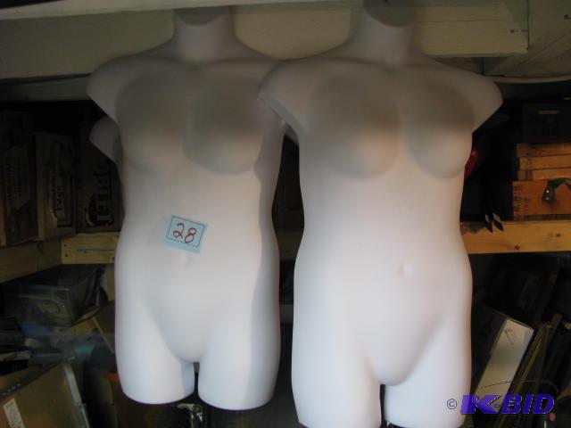 two hanging white half body forms&nbsp...