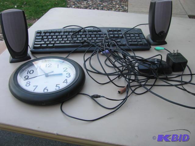 computer keyboard and speakers, mouse and clo...