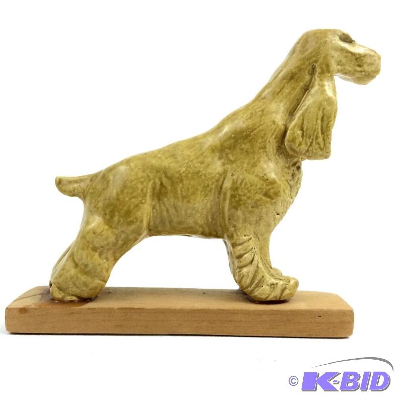 lot 24 image: Primitive Dog Hand Created  Statue Mounted to a Wooden Base