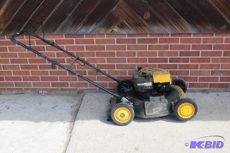 lot 46 image: Yard Man 6 HP Lawn Mower  Cord Pulls freely, ...