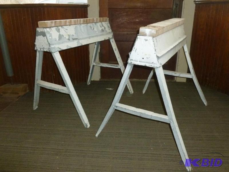 A pair of Ebco metal bodied fold up saw horse...