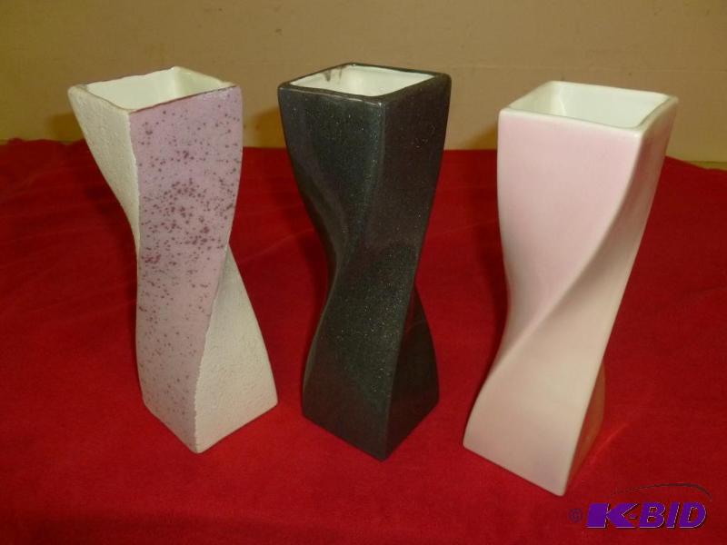 Lot of three nice twisted ceramic vases that ...