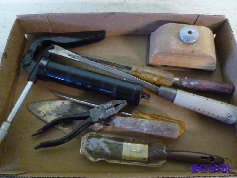 This lot consists of a small grease gun, larg...