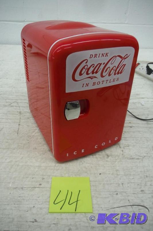 lot 44 image: Small coca-cola fridge, also has warming option. Untested but powers on.