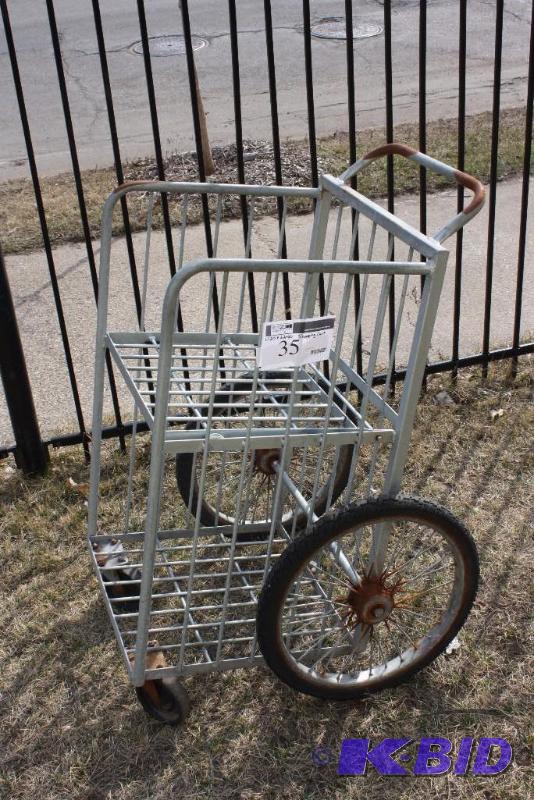 lot 35 image: Metal Shopping Cart wTwo Levels Handle 4 Wheels 20 x 22 x 40.