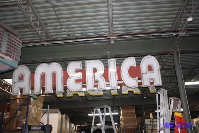lot 53 image: America Electric Sign America In Font RedWhite 180 x 11 x 36.