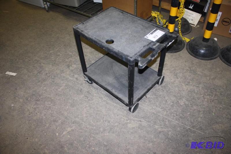 lot 89 image: Plastic Push Cart wTwo Shelves & Wheels Black 27 x 18 x 25.5.