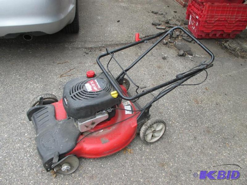 lot 38 image: Yard machines mower, motor runs but bad wheel...