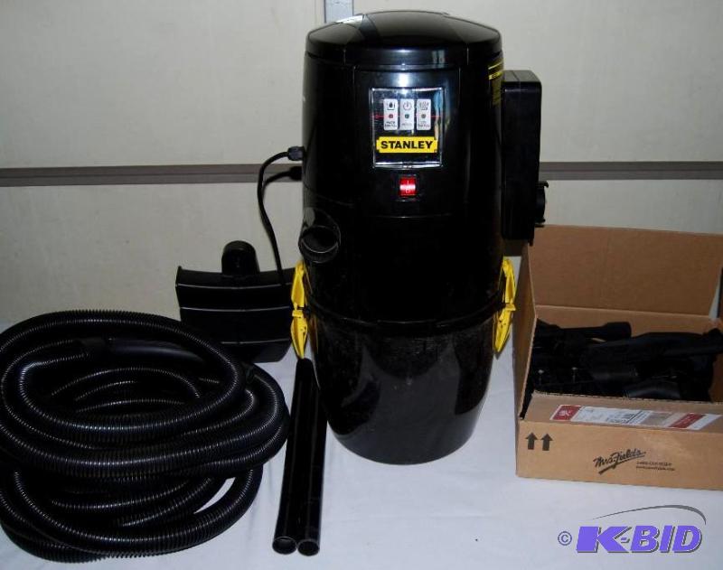 lot 15 image: Stanley Wall Mount WetDry Vac, with hose and...