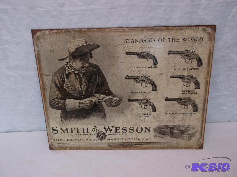 lot 104 image: Smith and Wesson sign measuring 16" L x ...