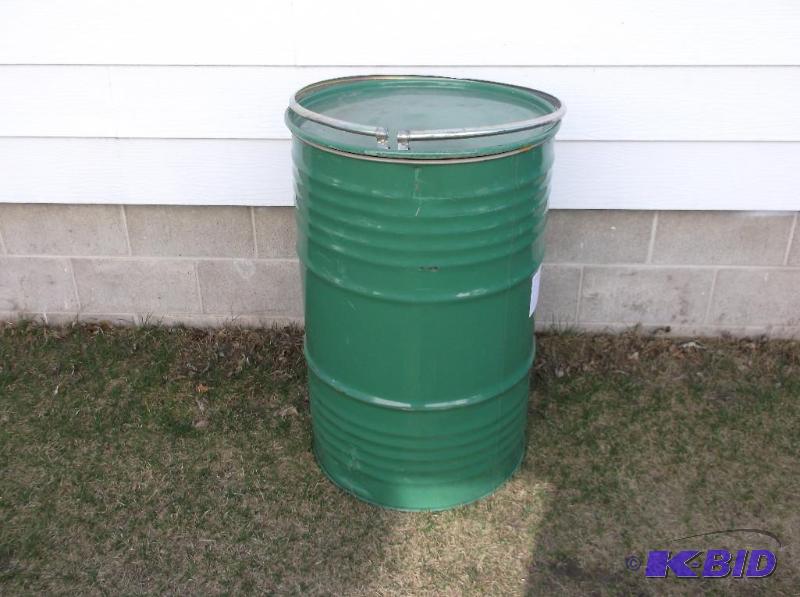 lot 172 image: Green steel 55 gal. food grade barrel has den...