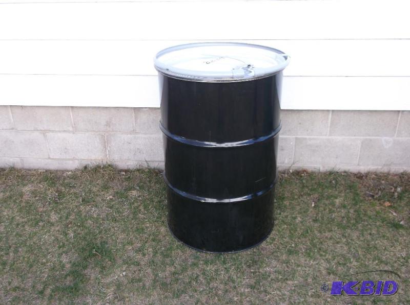 lot 173 image: Black steel 55 gal. food grade barrel with lo...