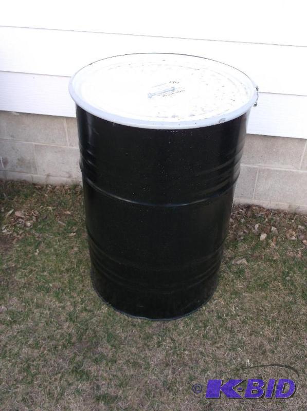 lot 176 image: Black steel 55 gal. food grade barrel with lo...