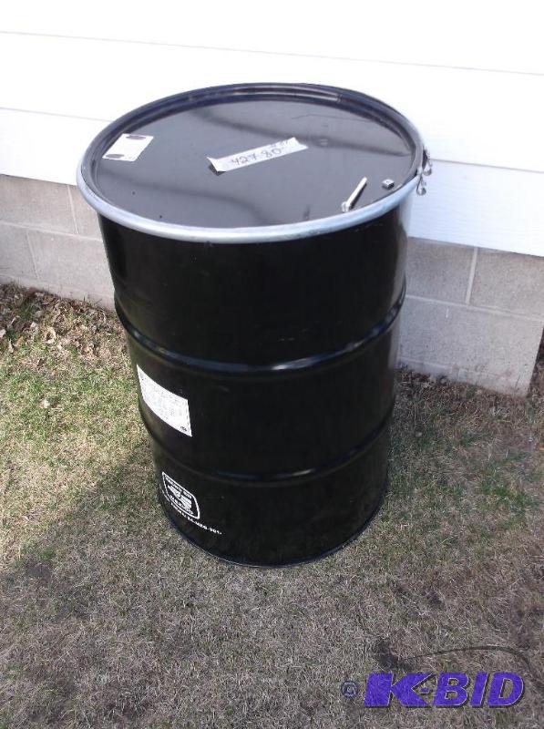 lot 177 image: Black steel 5 gal. food grade barrel with loc...