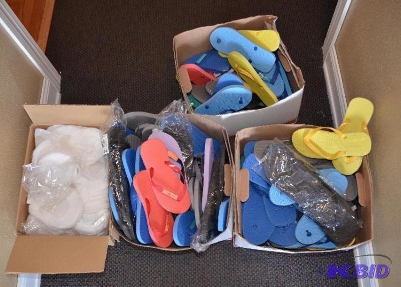 lot 115 image: 3 boxes of slippers, 1 box of head phone cove...