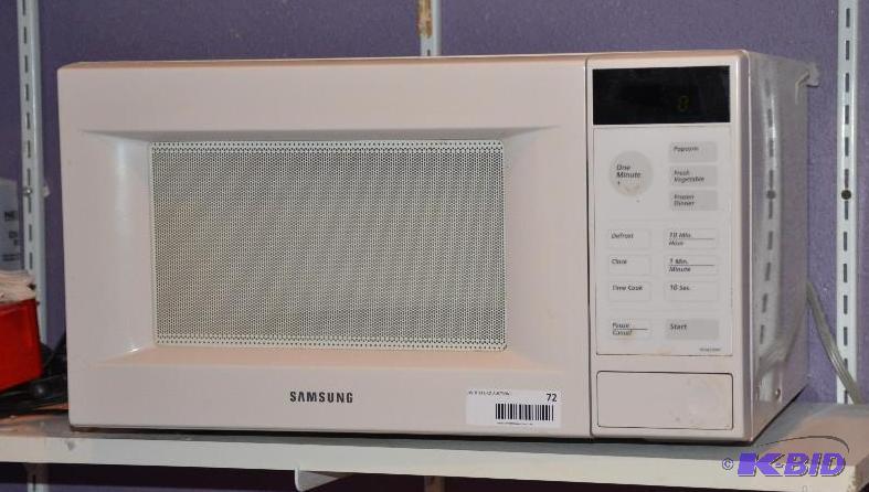 lot 72 image: Samsung microwave model MU4290W powers up...