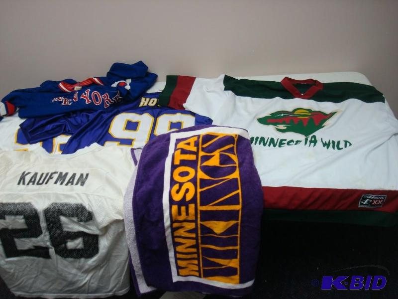 lot 139 image: Lot Of Jerseys And Towel, Used, Has Spots...