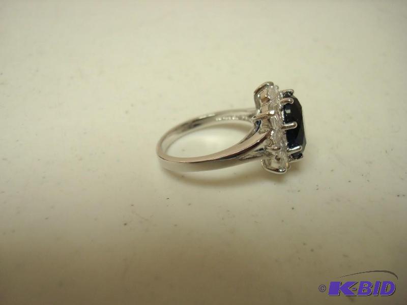 lot 156 image: Blue Stone Costume Ring...