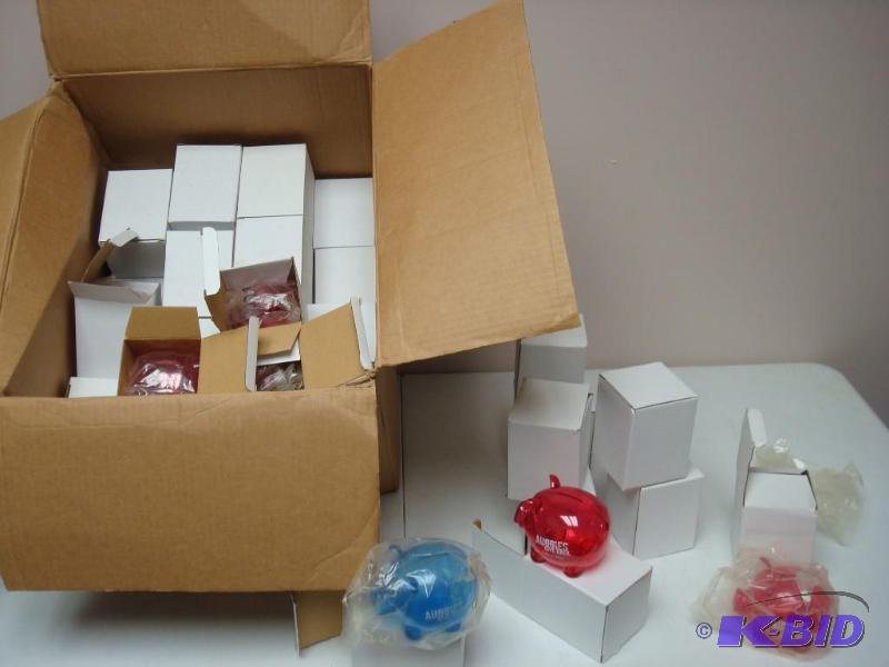 lot 186 image: Box Filled With Plastic 2010 Piggy Banks...