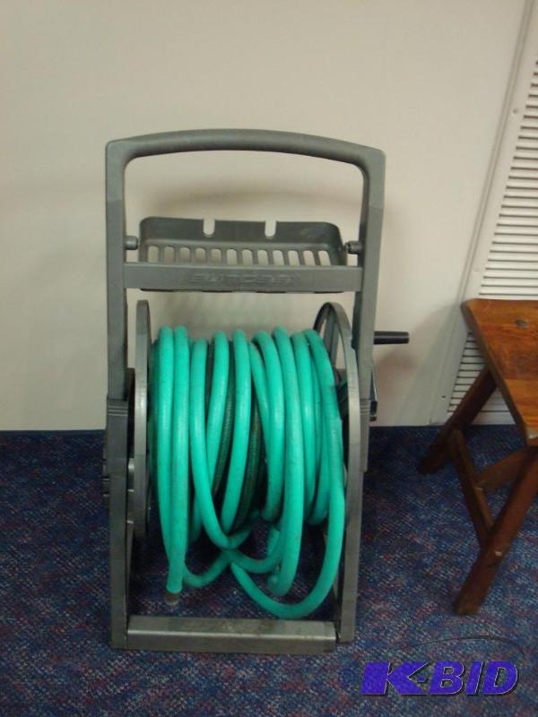 lot 39 image: Water Hose On Stand, Stand Shows Wear...