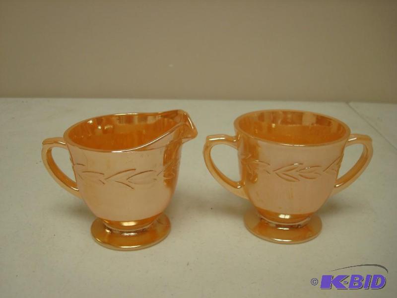 lot 90 image: Pair of Orange Luster Fire King Cups...