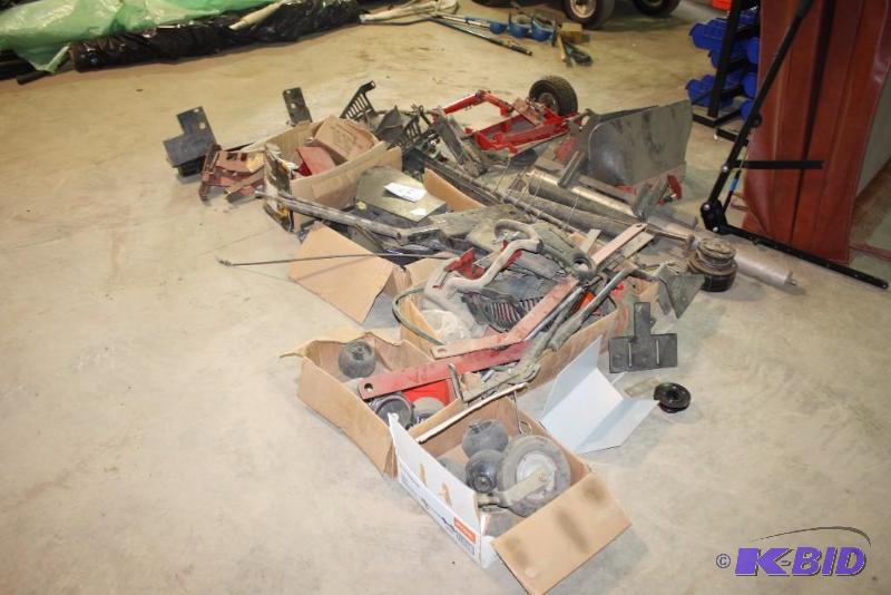 Floor Lot of Miscellaneous Lawn Mower Parts.