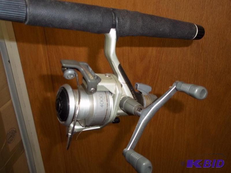 lot 13 image: Shimano 4000 reel with 6 medium action Lews...