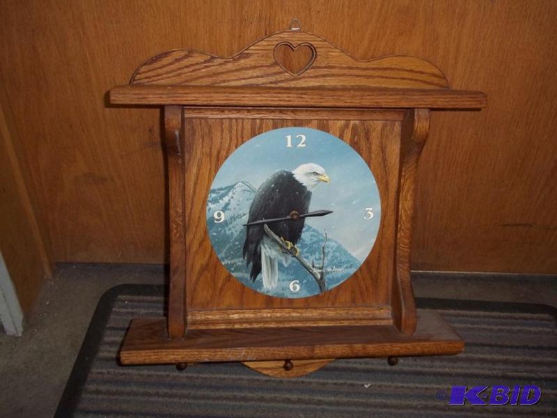 lot 22 image: Decor clock with eagle...