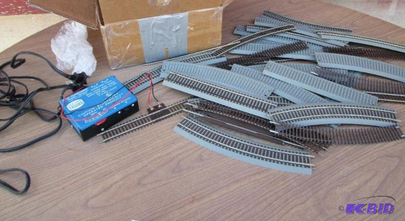 Lot of model train tracks with a hobby transf...