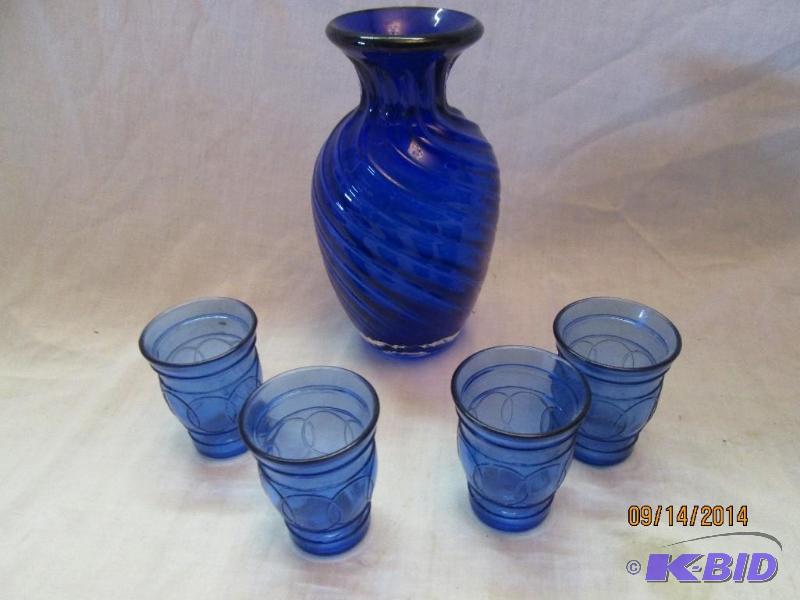 Blue glass pitcher with glasses...