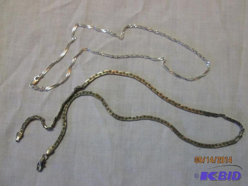 2 chain necklaces...