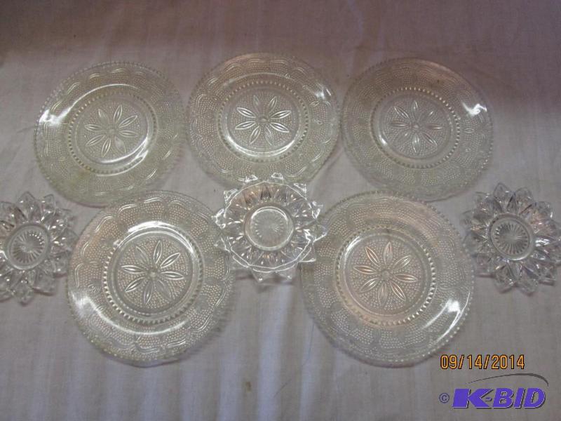 Glass saucers and plates, very ornate, see al...