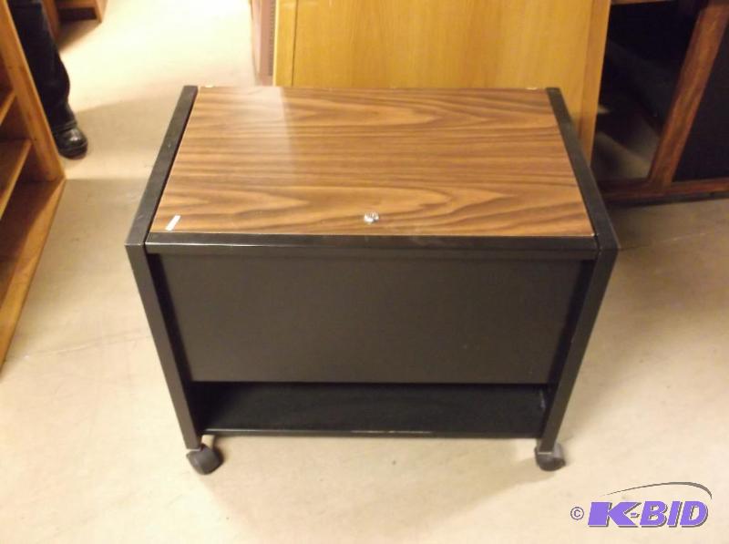 lot 14 image: Metal locking cabinet on castors no key for l...