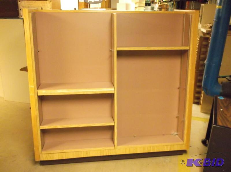 lot 15 image: 2 sided bookshelf on castors measuring 59 78...