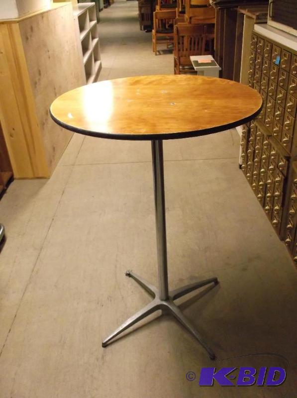 lot 23 image: High top table measuring 29 34" Dia. x ...