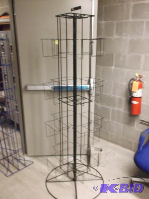 lot 3 image: Rotating magazine stand measuring 23 x 23&qu...