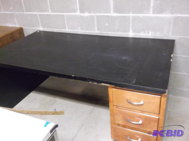 lot 64 image: Metal laminate top desk has some marks and sc...