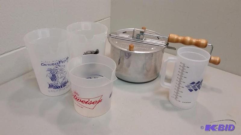 lot 21 image: Whirley pop popcorn Popper and Lot of Plastic Beer Pitchers