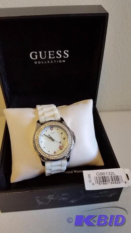 lot 33 image: Ladies Guess Watch.  White Band, Clear and Pink Crystals.  Appears New in Box.  See Pics