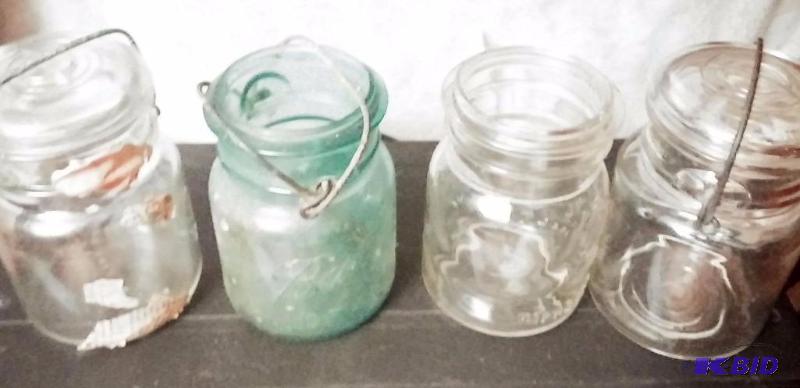 Lot of 4 Vintage Bell covered canning jars...